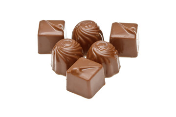 Chocolate pralines on white background