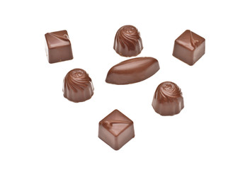 Chocolate pralines on white background
