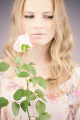 Romantic girl with pink rose
