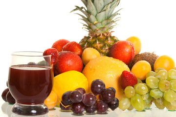 various fruits and a glass of fresh juice