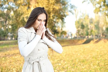 Woman blowing her nose