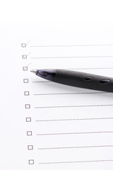 Checklist and pen closeup