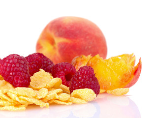 tasty cornflakes and fruit isolated on white