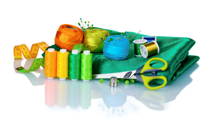 bright thread, measuring tape and fabric isolated on white