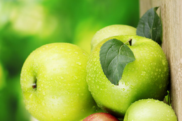 Fresh organic apples on wooden table isolated on white