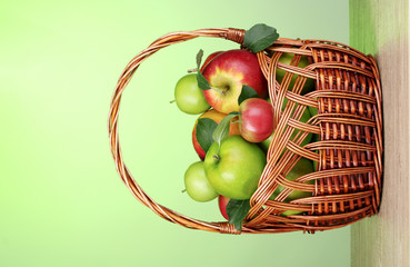 Healthy ripe apples in the bascet on table