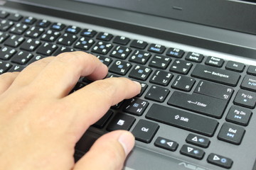 Fingers Typing on Laptop