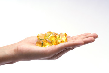 Cod liver oil pills  in the hand