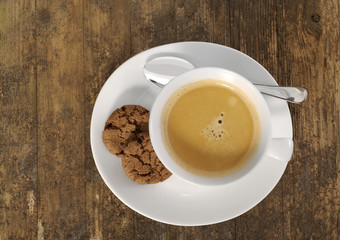 cup of coffee on old wooden table