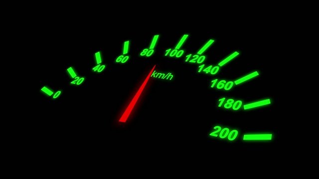 Growing speedometer of a car over black background