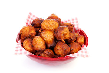 Bowl with Pile of Dutch donut also known as oliebollen