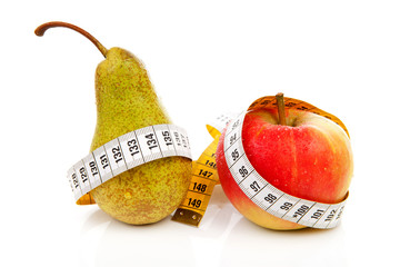 healthy diet; pear and apple with measure tape