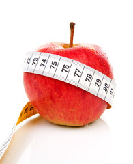 healthy diet; red apple with measure tape