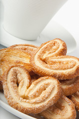 Cookies from flaky pastry and a cup of coffee