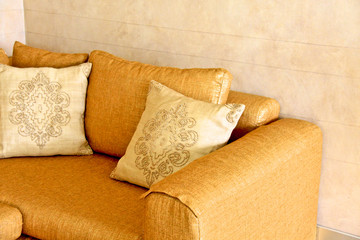 nice orange sofa with pillows