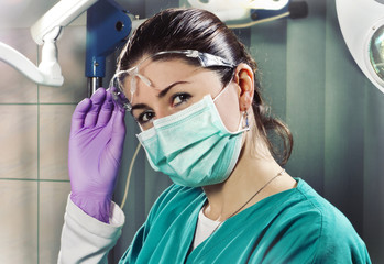 Fototapeta na wymiar Female Surgeon in Operating Room