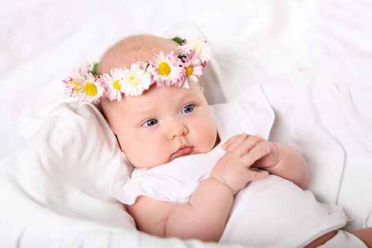 Portrait of a baby with a wreath
