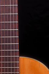 Obraz premium Classic Guitar (Spanish) fretboard, black background.