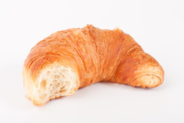 Fresh and tasty croissant over white background