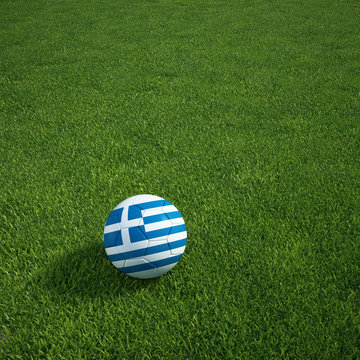 Greece soccerball lying on a grass field