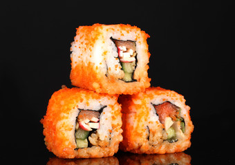 delicious sushi on black background