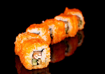 delicious sushi on black background