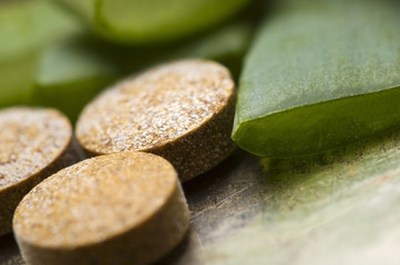 aloe vera plant with pills - herbal medicine