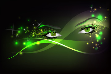 Dark background with green glamour shining  eyes.