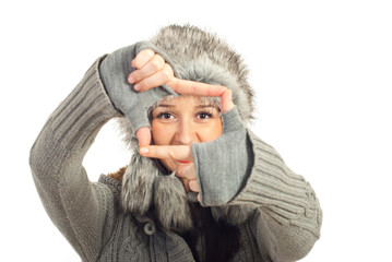 Winter woman framing her eyes
