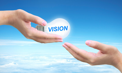 hand pressing vision button on a touch screen interface