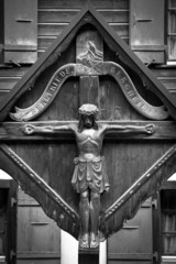 Wooden cross with Jesus in Zermatt, Switzerland (b&w picture)