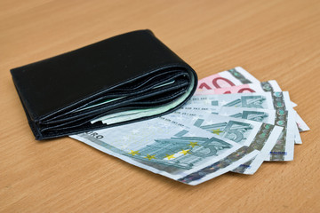 Euro, europe money, banknotes and wallet on the table