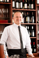 Wine bar waiter happy male in restaurant