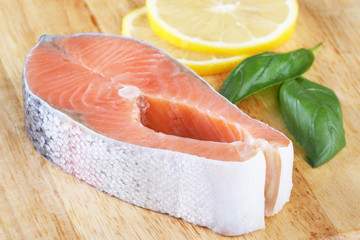 A piece of salmon on a cutting board