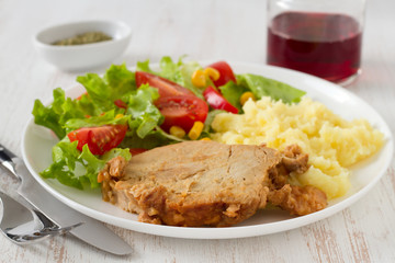 pork with mashed potato and salad
