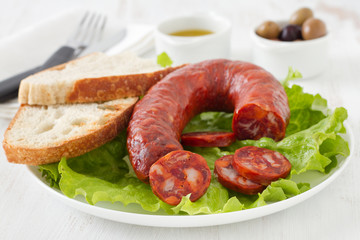 sausage with bread on the plate