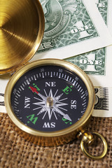 Compass Pointing North with US Dollars