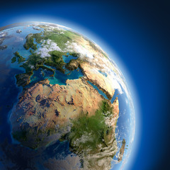 Fototapeta premium Earth with high relief, illuminated by the sun