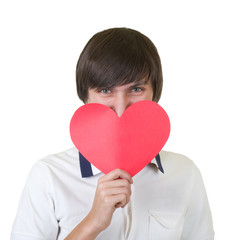 Young man holding red heart