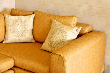 nice orange sofa with pillows
