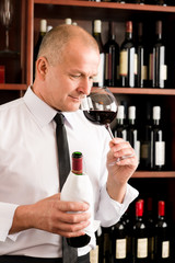 Bar waiter smell glass red wine restaurant