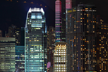 Fototapeta na wymiar Details of business buildings at night in Hong Kong
