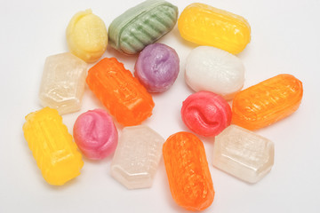 a bunch of multicolored sweet caramel candies