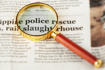 Newspaper with Magnifying Glass