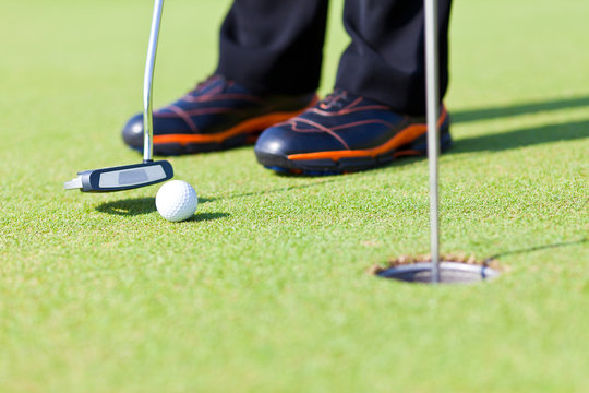 Golf Green Hole Course Man Putting Ball Inside Short Putt