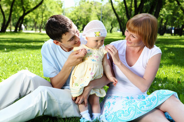 Young family together in the park