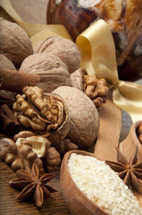 Walnut, wood nut, anise and sesame against a dark background