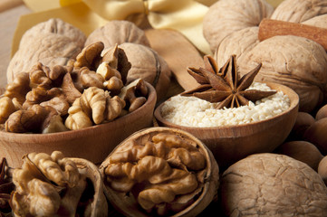 Walnut, wood nut, anise and sesame against a dark background