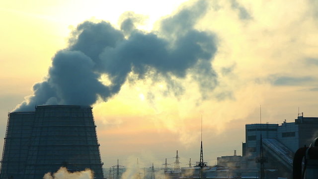winter sunset with smoke pollution from termal station