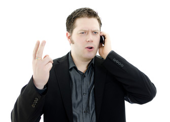 Portrait of business man talking on mobile phone.